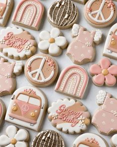 decorated cookies with pink and white designs on them are displayed in front of the camera