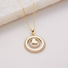 "Heart inside the Sun, Heart surrounded with Circle Pave Cz Solid Gold Layers,  Minimalist Design Pendant Necklace Jewellery 10K 14K 18K, CZ Simulated Diamond, Jewelry for everyday wear  Sizes of the *Flying Hearts Pendant* * 0.70inch /  17mm (excluding bail) * 0.85inch /  22mm (including bail) * 100% 10K 14K 18K Solid Yellow Gold (Not Gold Vermail or Not Gold Plated) * 100% 14K  Solid Whte Gold (Not Gold Vermail or Not Gold Plated) * Price includes the chain when \"Pendant and Chain option\" is chosen. * Cubic Zirconia clear simulated diamonds * Heart inside the Sun Pendant is a lightweight item. * Polished finish EU and UK taxes; *EU and UK orders over £135/€150 are subject to customs, import duties and tax charges once they reach their destination. This means that the recipient will be Gold Heart Cut Halo Jewelry, Neck Necklace, Delicate Gold Jewelry, Locket Design, High Jewelry Ring, Diamond Pendent, Beautiful Symbols, Sun Pendant, Gold Chain With Pendant