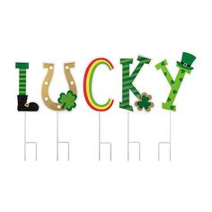 the word lucky is made up of green and yellow letters with shamrocks on them