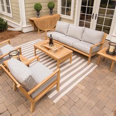 an outdoor patio with furniture and potted plants