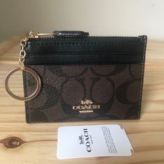 100% Authentic Coach Signature Mini Id Skinny Brown/Black And Gold Hardware Brand New With Tags Keys Ideas, Black And Gold Hardware, Coach Card Holder, Coach Wallets, Birkenstock Boston Shearling, Boston Shearling, Coach New York, Bags Coach, Coach Wallet