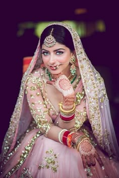 a woman in a pink bridal outfit