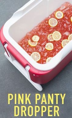 the pink party dropper is filled with lemons and ice cubes to cool off