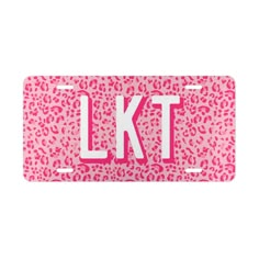 pink leopard print license plate with the letter kt