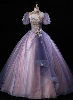 Begin a new chapter in a dress that speaks with the gentle whisper of a butterfly's wings. The multi-tonal tulle of this Quinceanera gown fans out in a spectrum of purples, from the deepest lilac to the faintest lavender, reminiscent of the delicate dance of butterflies over a meadow. The bodice, rich with golden and silver embroidery, brings forth an image of these graceful creatures alighting on flowers, their beauty captured in every stitch. With sheer sleeves and floral accents that mirror nature's own design, this dress is a testament to the transformative journey of a young woman coming into her own, as mesmerizing and unique as a butterfly's path through the skies. Ball Gowns Light Purple, Purple Cinderella Dress, Fairy Flowy Dress, Purple Tulle Ball Gown, Purple Princess Dress Fairytale, Tangled Dress Prom, Purple Quinceanera Dresses With Sleeves, Purple Dance Dress, Purple And Gold Dress Gowns