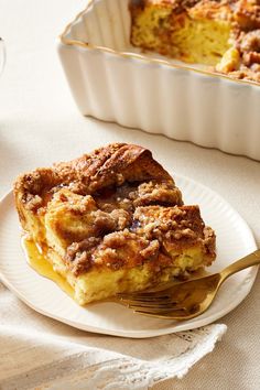 a white plate topped with food next to a casserole dish