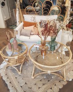 two wicker coffee tables sitting on top of a wooden floor