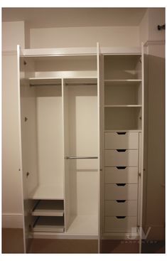 an empty white closet with drawers and shelves