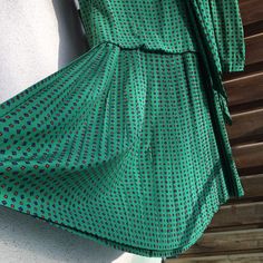 Guy Laroche high neck silk green vintage pleated drop waist dress. Amazing green with tiny geometric print. Pleated / plissee from waist down. Tie front. Buttons on the back. Very good vintage condition. A little bit wrinkled. I don't know exactly the era it's from but should be the 1980s. With shoulder pads. Lined upper part. Zipper on the back in the lining part, buttoned down on the back on the outer fabric. Measurements (item lying flat on the ground, doubled for chest, waist and hips): Length 111 cm (43,70 inches) Bust armpit to armpit 90 cm (35,43 inches) Waist 90  cm (35,43 inches) Hips about 114 cm (44,88 inches) (the fabric spread out) Sleeve from shoulder seam 63 cm (24,80 inches) Shoulder width measured on the back 37 cm (14,57 inches) Please note that the item is vintage and us Green Silk A-line Midi Dress, Green Evening Dresses With Accordion Pleats, Chic Green A-line Pleated Dress, Green Pleated Waist Midi Dress For Formal Occasions, Green Pleated Skirt Evening Dress, Green Midi Dress With Pleated Waist For Formal Occasions, Formal Green Midi Dress With Pleated Waist, Green Vintage A-line Midi Dress, Green Pleated Summer Dress For Formal Occasions