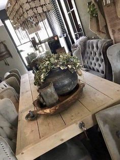 a wooden table topped with a potted plant