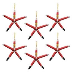 six red and black starfish ornaments hanging from strings