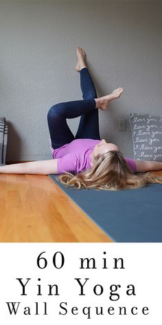 a woman is doing yoga on the floor with her legs spread out in front of her