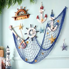 there is a blue hammock hanging on the wall with other items in it