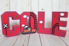 the word sale spelled out with a toy train