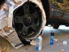 the tire on the car is covered with newspaper and other things to use for repair