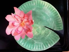 a paper plate with a pink flower on it