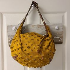 Limited Edition Louis Vuitton Onatah Gm Suede Perforated Monogram Hobo Shoulder Bag. The Outside Of This Bag Has Perforated Suede Flowers With The Classic Lv Monogram. The Striped Strap Is Adjustable And The Brown Leather Is A Great Accent Contrast To The Yellow Suede. The Inside Is Made Of Buttery Soft Brown Leather. It Is In Great Used Condition- Just Needs A Little Tlc With Your Dry Cleaner. The Inside Has A Little Bit Of Pen Marks As I Have Shown You In The Pictures. If You Have Any Questions Please Feel Free To Message Me And I Will Get Back To You In A Timely Manner. I Consider All Offers- Feel Free To Send Me An Offer. Remember To Bundle To Get A Discount And Save On Shipping. May Limited Edition Louis Vuitton, Gm Monogram, Louis Vuitton Limited Edition, Hobo Shoulder Bag, Lv Monogram, Soft Brown, Authentic Louis Vuitton, Louis Vuitton Bag, Brown Leather