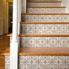 a stair case with decorative tile on it