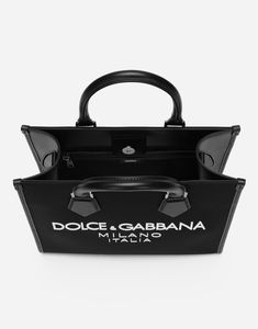 Small shopper in nylon and calfskin with rubberized Dolce & Gabbana Milano logo: Black Concealed magnetic fastening Calfskin top handles Adjustable and detachable tape strap with calfskin details Nylon lining, a zipped pocket and two flat pockets Item comes with a branded dust bag Measurements: H27 x W31 x D16 cm Made in Italy Designer Black Bag With Logo Print, Luxury Leather Bags With Logo Print, Leather Tote Bag With Logo Print, Designer Leather Bag With Logo Print, Leather Bags With Logo Print For Everyday Use, Designer Bags With Logo Print For Shopping, Designer Shopping Bags With Logo Print, Black Shopping Bags With Logo Hardware, Black Bags With Logo In Coated Canvas