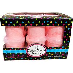 four pink cotton candy flavored candles in a black box with polka dots on it