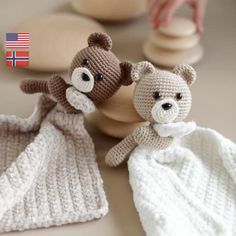 two knitted teddy bears sitting next to each other