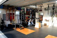 the inside of a garage with lots of equipment