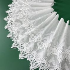 an image of white lace on green background