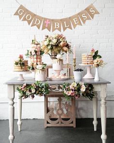 a table with flowers and candles on it, next to a wall that says alyssa saved for a wedding