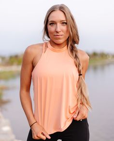 The Peach Tie Back Halter is ready for whenever you are. Made with polyester-spandex blend fabric, it's lightweight and breathable. Cut with high halter top neckline and a cute wrap around in the back, style is at the heart of this sweet and sporty tank. 🍑 Sporty Sleeveless Halter Top With Built-in Bra, Sleeveless Halter Top With Built-in Bra For Workout, Athleisure Top With Built-in Bra And Halter Neck, Summer Tank Top With Built-in Bra For Light Exercise, Stretch Halter Neck Activewear, Athleisure Halter Top With Built-in Bra And Stretch, Summer Halter Neck Activewear, Stretch Racerback Halter Top For Workout, Athleisure Halter Neck Top For Yoga