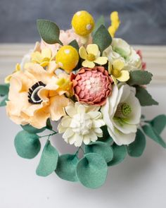 a bouquet of flowers sitting on top of a table