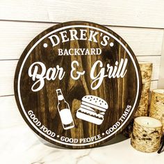 a wooden sign that says derek's backyard bar and grill