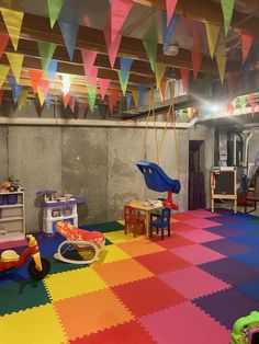 an indoor play area with toys and colorful tiles on the floor that says greatmats