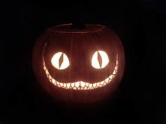 a carved pumpkin with glowing eyes on it