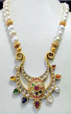 Vintage antique 23 K solid gold and natural Navratna gemstones set large pendant strung together with pearls and gold beads. Great one of type collection piece in very good condition. Length-Free size, Size of pendant-10/9 cm, gross weight-137 grams, pendant weight only-76 grams, Material-23 K gold, Natural uncut Diamonds, and Natural Navratna gemstones. Traditional Kundan Pearl Necklace In Yellow Gold, Traditional Yellow Gold Kundan Pearl Necklace, Diwali Pearl Pendant Necklace, Kundan Temple Jewelry Necklace With Round Gemstone Beads, Temple Jewelry Style Kundan Necklace With Gemstones, Gold Multi-stone Kundan Temple Necklace, Gold Kundan Multi-stone Temple Necklace, Traditional 22k Gold Multi-stone Necklaces, Traditional Multi-stone 22k Gold Necklace