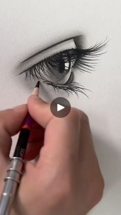 someone drawing an eye with a pencil