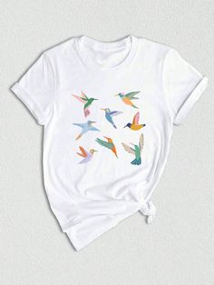 Introducing our Birds on Wire Shirt, the perfect gift for any bird lover or nature enthusiast in your life! This minimalist t-shirt features a beautiful design of birds perched on a wire, making it a stylish and unique addition to any wardrobe. Whether you're a woman who loves nature or an animal lover looking for the perfect shirt, this Birds t-shirt is sure to become a favorite in your collection. Made with high-quality materials, our Birds on Wire Shirt is not only stylish but also comfortabl Summer Crew Neck T-shirt With Bird Print, Casual Crew Neck T-shirt With Bird Print, Casual Summer T-shirt With Bird Print, Birds On Wire, Nature Enthusiast, Minimalist Shirts, Nature Shirts, Bird Lover, Women T Shirts