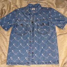 Karl Kani Signature Denim All-Over Print Short Sleeve Shirt In Blue Worn Twice Super Fly Heavy Weight Good Quality Denim If You Don’t Know About Karl Kani He’s Basically The Originator Of All Your Favorite 90s Rappers Style The Jeans The Jackets All Of It I Wore This As A Dress W Timbs And On Top Of A White Fitted Shirt And Jeans That Were The Same Color As The Top So It’s A Versatile Piece Size Men’s Medium But Fits Like A Men’s Large Blue Chambray Denim Jacket For Summer, Casual Short Sleeve Fitted Denim Jacket, Casual Fitted Short Sleeve Denim Jacket, Fitted Short Sleeve Denim Jacket, Indigo Denim Short Sleeve Shirt, Medium Wash Short Sleeve Denim Jacket, Indigo Short Sleeve Denim Shirt, Short Sleeve Medium Wash Cotton Denim Jacket, Casual Blue Chambray Denim Jacket