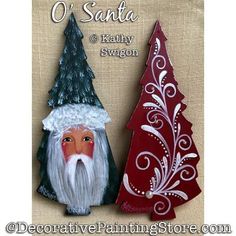 two small christmas trees with santa and tree decorations