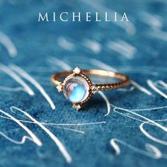 "Our current turnaround time for regular orders is 6-8 weeks. For urgent orders, please shop our Ready-to-Ship collection below (7-10 business days): https://michellia.com/collections/ready-to-ship (please copy and paste into browser) -------- 「Stella」- Aura of Galaxy Ring, in Moonstone Traveled through moons and stars, our galaxy-inspired \"Stella\" is designed to remind us of the infinite possibilities in our incredible universe. The focal iridescent gem is surrounded by four pieces of genuine Celestial Moonstone Promise Ring, Formal Moonstone Ring With Gemstone Accents, Mystical Moonstone Ring, Ethereal Moonstone Wedding Ring With Rose Cut Diamonds, Celestial Moon-shaped Jewelry With Rose Cut Diamonds, Celestial Moon Shaped Jewelry With Rose Cut Diamonds, Celestial Moon-shaped Ring With Rose Cut Diamonds, Moon Phase Diamond Rings As Gift, Celestial Moonstone Jewelry For Promise