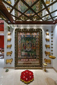 an ornately decorated room with gold and red decorations on the ceiling, along with paintings