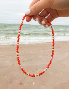 Orange, white and gold choker! Check out our handmade choker collection! We have so many unique and different chokers to choose from! Trendy Orange Festival Jewelry, Adjustable Orange Choker With Round Beads, Adjustable Orange Choker Jewelry, Handmade Red Choker For Beach, Handmade Summer Choker As A Gift, Adjustable Red Choker For Beach, Red Beaded Choker Necklace For Summer, Adjustable Red Summer Choker, Handmade Orange Choker As Gift