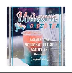 an advertisement for unicorn road tea with a pink drink in the middle and white straws sticking out of it