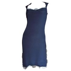 A beautiful navy blue silk dress from Bill Blass. It is semi fitted with a sweetheart neckline and 12" slits on each side at the hem. The neckline, hem and slits are finished with delicate airy scalloped lace. The dress is lined in navy silk and has matching back zipper. Fits sizes Small, Medium. Marked US size 4. Bust 34" Waist 28" Hips 37" Length 35" Knee-length Fitted Lined Slip Dress, Fitted Knee-length Lined Slip Dress, Lined Knee-length Fitted Slip Dress, Fitted Sheath Midi Dress With Bias Cut, Fitted Bias Cut Slip Dress, Elegant Lined Slip Dress With Fitted Bodice, Formal Fitted Lined Slip Dress, Fitted Evening Slip Dress Lined, Fitted Knee-length Slip Dress For Cocktail