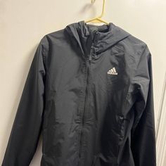 Adidas Rain.Rdy Rain Jacket Black Hooded Performance Running Women’s Size Small 20” Pit To Pit 24” Length Black Adidas Windbreaker For Winter, Black Long Sleeve Adidas Activewear, Adidas Sports Outerwear With Moisture-wicking, Adidas Black Windbreaker With Logo, Adidas Moisture-wicking Athleisure Outerwear, Functional Black Adidas Outerwear, Functional Black Adidas Logo Outerwear, Functional Black Outerwear With Adidas Logo, Black Adidas Outdoor Outerwear