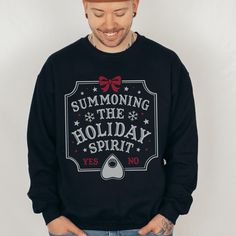 Embrace the dark side of the festive season with our Goth Christmas Sweater. Featuring a captivating Ouija board graphic, this Creepmas Winter Solstice Sweatshirt is the perfect blend of spooky and stylish. Whether you're celebrating Yule or simply love all things weirdcore, this Hail Satan Xmas Shirt is a standout choice for a unique holiday look. Give the gift of the macabre this season with our Spooky Christmas sweatshirt - a perfect treat for those who dance to a different beat during the ho Celebrating Yule, Yule Holiday, Pagan Yule, Goth Christmas, Diy Ugly Christmas Sweater, Spooky Christmas, Ouija Board, Xmas Shirts, Winter Solstice