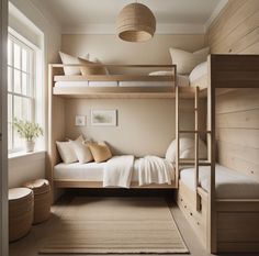 a bedroom with bunk beds and pillows in it