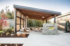 an outdoor living area with patio furniture and lighting