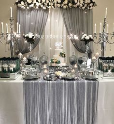 a table topped with lots of cake and candles