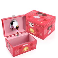 two pink boxes with designs on them, one has a mirror and the other has a clock in it