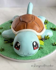 there is a cake shaped like a turtle on the plate